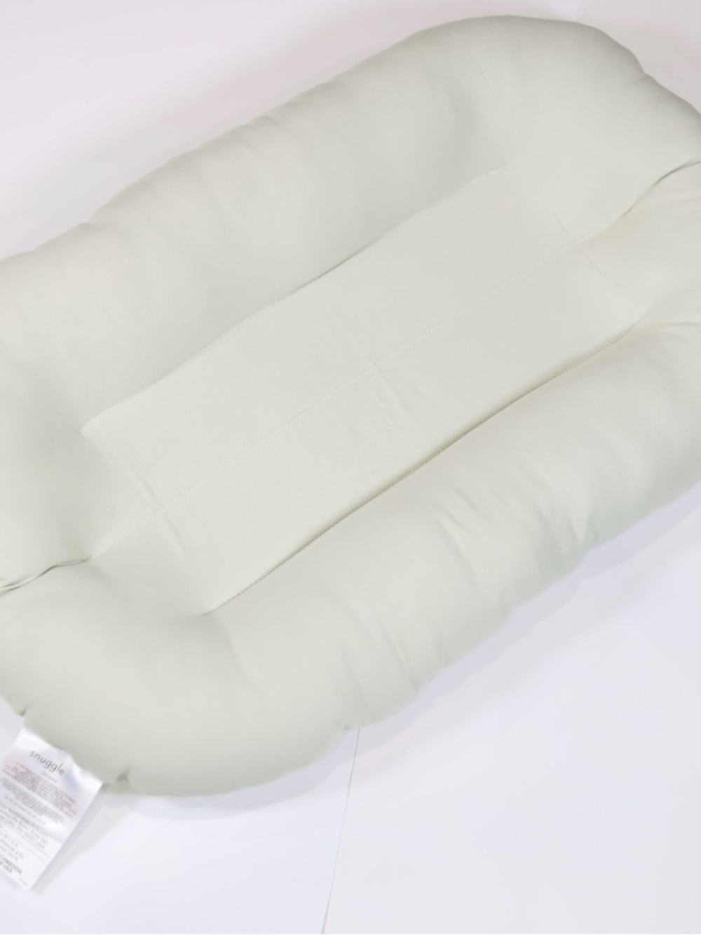 Snuggle Me Infant Lounger.
